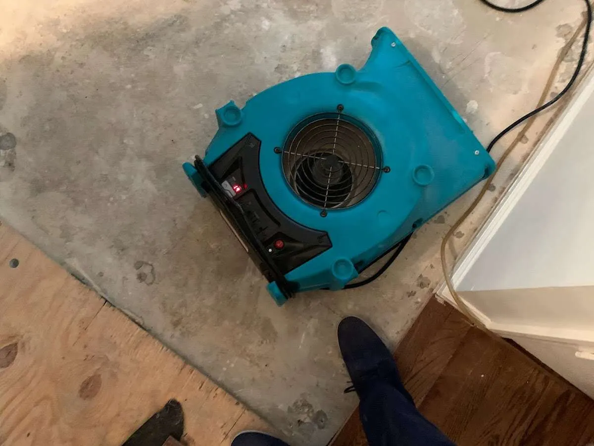 Air mover drying subfloor during Leak Detection & Repair in Lawton